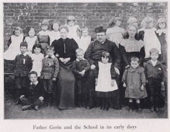 Father Gerin with pupils at St.Polycarps